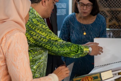 2. Ambassador H.E. Datuk Eldeen Husaini Mohd Hashim sharing the Braille Qur’an’s content with Rector Chems-Eddine Hafiz and a guest.